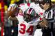 Ohio State running back Carlos Hyde (34) reacts after a run during the first quarter of an NCAA college football game against Michigan in Ann Arbor, Mich., Saturday, Nov. 30, 2013. (AP Photo/Tony Ding)