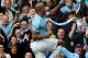 Manchester City's Vincent Kompany celebrates with fans after scoring against West Ham during the English Premier League soccer match between Manchester City and West Ham United at the Etihad Stadium, Manchester, England, Sunday, May 11, 2014. (AP Photo/Rui Vieira)