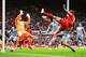 LIVERPOOL, ENGLAND - MAY 11: Daniel Agger of Liverpool (5) shoots past Tim Krul of Newcastle United to score their first goal during the Barclays Premier League match between Liverpool and Newcastle United at Anfield on May 11, 2014 in Liverpool, England. (Photo by Laurence Griffiths/Getty Images)