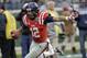 Mississippi wide receiver Donte Moncrief runs the ball into the end zone as he scores a touchdown on a 28-yard pass play against Georgia Tech in the second quarter of the NCAA college football Music City Bowl game on Monday, Dec. 30, 2013, in Nashville, Tenn. (AP Photo/Mark Humphrey)
