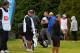 Alastair Forsyth (center, hat in hand) and others awaited the tragic news regarding Forsyth's caddie, Ian McGregor, on Sunday.
