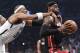 Brooklyn Nets forward Paul Pierce (34) fouls Miami Heat forward LeBron James (6) as he drives through the lane to score in the first period during Game 3 of an Eastern Conference semifinal NBA playoff basketball game on Saturday, May 10, 2014, in New York. Pierce was called for a flagrant foul and James scored on the play. (AP Photo/Julie Jacobson)