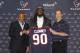 HOUSTON, TX - MAY 09: Jadeveon Clowney (C) displays his Houston Texans jersey with general manager Rick Smith (L) and Houston Texans head coach Bill O'Brien (R) at Reliant Stadium on May 9, 2014 in Houston, Texas. Clowney was selected by the Texans with the first overall pick in the 2014 NFL draft. (Photo by Bob Levey/Getty Images)