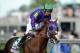 May 3, 2014; Louisville, KY, USA; Victor Espinoza aboard California Chrome (5) after winning the 2014 Kentucky Derby at Churchill Downs. Mandatory Credit: Jamie Rhodes-USA TODAY Sports