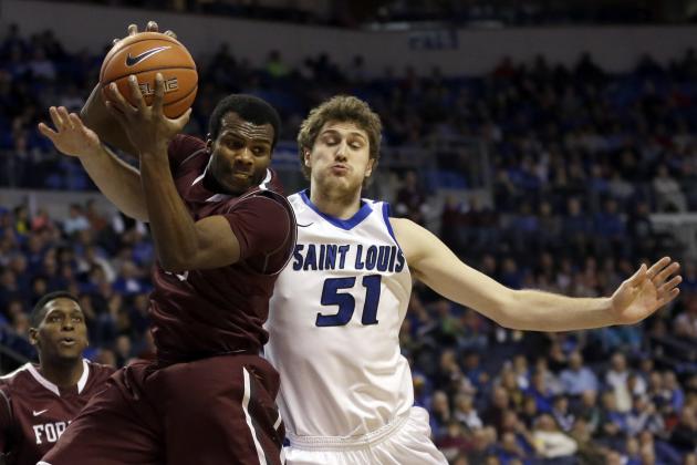 Fordham's Jon Severe, left, grabs a rebound along side Saint Louis' Rob Loe during the second half of an NCAA college basketball game Saturday, Jan. 18, 2014, in St. Louis. Saint Louis won 70-48. (AP Photo/Jeff Roberson)