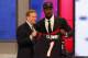 NEW YORK, NY - MAY 08: Jadeveon Clowney of the South Carolina Gamecocks stands on stage with NFL Commissioner Roger Goodell after he was picked #1 overall by the Houston Texansduring the first round of the 2014 NFL Draft at Radio City Music Hall on May 8, 2014 in New York City. (Photo by Cliff Hawkins/Getty Images)