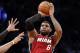 Miami Heat forward LeBron James (6) shoots a three-pointer in the second half of Game 4 of a second-round NBA playoff basketball game against the Brooklyn Nets at the Barclays Center, Monday, May 12, 2014, in New York. James tied his playoff career high with 49 points as the Heat defeated the Nets 102-96 to go ahead 3-1 in the best of seven series. (AP Photo)