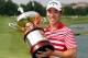 IRVING, TX - MAY 19: Sang-Moon Bae of South Korea celebrates with the championship trophy after winning the 2013 HP Byron Nelson Championship at the TPC Four Seasons Resort on May 19, 2013 in Irving, Texas. (Photo by Tom Pennington/Getty Images)