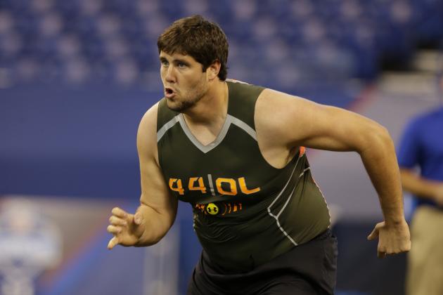 Arkansas offensive lineman Travis Swanson runs a drill at the NFL football scouting combine in Indianapolis, Saturday, Feb. 22, 2014. (AP Photo/Michael Conroy)