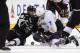 Los Angeles Kings center Jarret Stoll, left, and Anaheim Ducks center Andrew Cogliano battle for the puck during the third period in Game 4 of an NHL hockey second-round Stanley Cup playoff series, Saturday, May 10, 2014, in Los Angeles. The Duck won 2-0. (AP Photo/Mark J. Terrill)