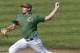 Miami pitcher Andrew Suarez throws in the third inning of an NCAA college baseball game against Florida State, Sunday, March 2, 2014, in Tallahassee, Fla. Florida State won 13-6. (AP Photo/Phil Sears)