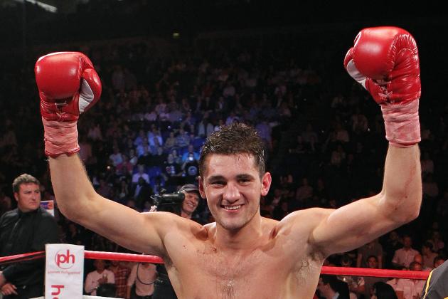 Britain's Nathan Cleverly celebrates beating Poland's Aleksy Kuzlemski to win the WBO light-heavyweight World Championship boxing match in London, Saturday, May 21, 2011. (AP Photo/Simon Dawson)