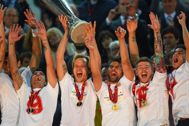 TURIN, ITALY - MAY 14:  Ivan Rakitic of Sevilla lifts the Europa League trophy during the UEFA Europa League Final match between Sevilla FC and SL Benfica at Juventus Stadium on May 14, 2014 in Turin, Italy.  (Photo by Mike Hewitt/Getty Images)