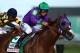 LOUISVILLE, KY - MAY 03: Jockey Victor Espinoza guides California Chrome #5 to the finish line to win the 140th running of the Kentucky Derby at Churchill Downs on May 3, 2014 in Louisville, Kentucky. (Photo by Andy Lyons/Getty Images)
