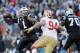 Carolina Panthers quarterback Cam Newton (1) passes the ball against the San Francisco 49ers during the second half of a divisional playoff NFL football game, Sunday, Jan. 12, 2014, in Charlotte, N.C. (AP Photo/Gerry Broome)