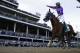 Victor Espinoza rides California Chrome to victory during the 140th running of the Kentucky Derby horse race at Churchill Downs Saturday, May 3, 2014, in Louisville, Ky. (AP Photo/David J. Phillip)