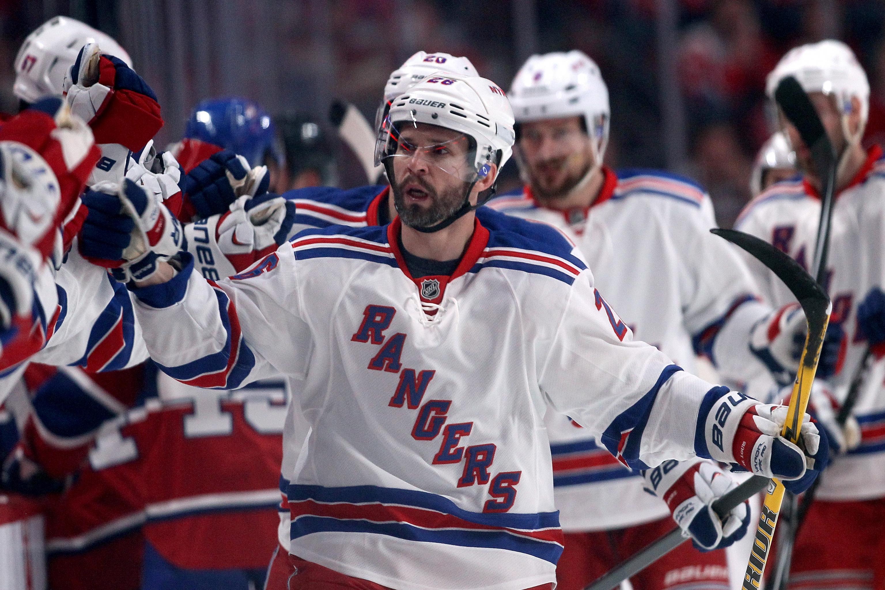 New York Rangers Martin St. Louis reacts after scoring the game