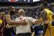 In this Wednesday, March 26, 2014 photo, Miami Heat guard Dwyane Wade, left, and Indiana Pacers guard Lance Stephenson, right, are separated by official David Jones during the second half of an NBA basketball game in Indianapolis. The Pacers won 84-83. Before the game, the teams chided one another with dueling comments. Afterward, nobody was ready to make up. And in between, the action got downright nasty. (AP Photo/AJ Mast)