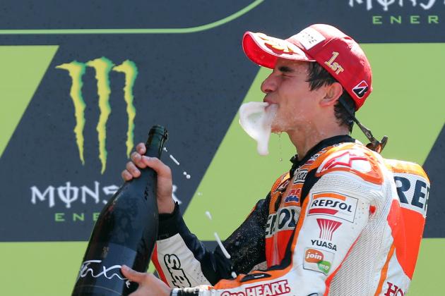 Spanish MotoGP rider Marc Marquez of the Repsol Honda Team drinks champagne on the podium after winning the MotoGP World Championship race at the Bugatti race track in Le Mans, western France, Sunday, May 18, 2014. (AP Photo/David Vincent)