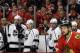 Los Angeles Kings players react as they watch teammates during the third period of Game 1 of the Western Conference finals in the NHL hockey Stanley Cup playoffs against the Chicago Blackhawks in Chicago on Sunday, May 18, 2014. The Blackhawks won 3-1. (AP Photo/Nam Y. Huh)