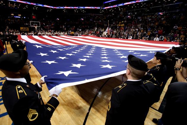 NEW YORK, NY - MARCH 16: The American Flag is held on the court as the National Anthem is sung before the game between the Virginia Commonwealth Rams and the Saint Joseph's Hawks during the Championship game of the 2014 Atlantic 10 Men's Basketball Tournament at Barclays Center on March 16, 2014 in the Brooklyn borough of New York City.  (Photo by Mike Lawrie/Getty Images)