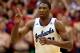 LAWRENCE, KS - JANUARY 18: Joel Embiid #21 of the Kansas Jayhawks reacts after scoring during the game against the Oklahoma State Cowboys at Allen Fieldhouse on January 18, 2014 in Lawrence, Kansas. (Photo by Jamie Squire/Getty Images)