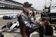 Kurt Busch stretches before the start of practice for the Indianapolis 500 IndyCar auto race at the Indianapolis Motor Speedway in Indianapolis, Monday, May 19, 2014. (AP Photo/Michael Conroy)