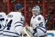 PHILADELPHIA, PA - OCTOBER 02: Jonathan Bernier #45 of the Toronto Maple Leafs celebrates with James Reimer #34 after defeating the Philadelphia Flyers 3-1 on October 2, 2013 at the Wells Fargo Center in Philadelphia, Pennsylvania. (Photo by Len Redkoles/NHLI via Getty Images)