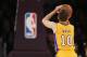 Los Angeles Lakers guard Steve Nash shoots a free throw as the NBA logo can be seen below the basket against the Portland Trail Blazersduring the first half of an NBA basketball game in Los Angeles, Tuesday, April 1, 2014. (AP Photo/Danny Moloshok)