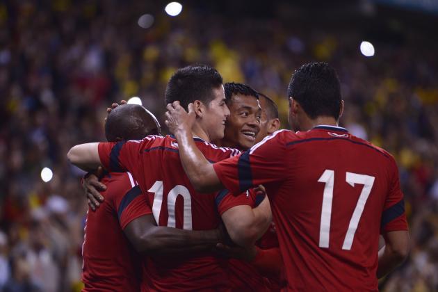 Colombia's James Rodriguez, second left, celebrates after scoring against Tunisia during an international friendly soccer match at Cornella-El Prat stadium in Cornella Llobregat, Spain, Wednesday, March 5, 2014. (AP Photo/Manu Fernandez)
