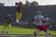Michigan's cornerback Charles Woodson (2) leaps to make an interception in the end zone in the first half on a pass from Washington State's Ryan Leaf during the 84th Rose Bowl in Pasadena, Calif., Thursday, Jan. 1, 1998. Watching the play are Michigan's William Peterson (23) and Washington States Kevin McKenzie (9). Player at right unidentified. (AP Photo/Mark J. Terrill)