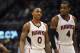 Atlanta Hawks guard Jeff Teague (0), who tied his career high with 34 points, and teammate Paul Millsap, who recorded his first career triple-double with 19 points, 13 rebounds and 2210 assists, walk off the court during overtime of their NBA basketball game against the Toronto Raptors Tuesday, March 18, 2014, in Atlanta. Atlanta won 118-113. (AP Photo/David Tulis)