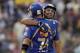Mumbai Indians' Rohit Sharma, facing camera, is congratulated by teammate Herschelle Gibbs after Sharma scored a century during an Indian Premier League (IPL) cricket match against Kolkata Knight Riders in Kolkata, India, Saturday, May 12, 2012. (AP Photo/Bikas Das)