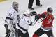 Los Angeles Kings defenseman Drew Doughty (8) and Chicago Blackhawks center Jonathan Toews (19) get into a pushing match in front of Los Angeles Kings goalie Jonathan Quick (32) during the first period of Game 2 of the Western Conference finals in the NHL hockey Stanley Cup playoffs Wednesday, May 21, 2014, in Chicago. (AP Photo/Charles Rex Arbogast)