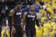 Miami Heat forward LeBron James, left, and guard Dwyane Wade walk off the court during a time out during the fourth quarter of Game 2 of the NBA basketball Eastern Conference finals against the Indiana Pacers in Indianapolis, Tuesday, May 20, 2014. The Heat defeated the Pacers 87-83 to tie the series at 1-1. (AP Photo/Michael Conroy)
