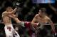 Cole Escovedo, left, and Renan Barao during a bantamweight bout at UFC 130, Saturday, May 28, 2011, in Las Vegas. (AP Photo/Julie Jacobson)