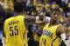 Indiana Pacers' Roy Hibbert (55) and Paul George celebrate during the second half of Game 1 of the Eastern Conference finals NBA basketball playoff series, Sunday, May 18, 2014, in Indianapolis. Indiana defeated Miami 107-96. (AP Photo/Darron Cummings)