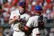 Philadelphia Phillies relief pitcher Jonathan Papelbon, left, and catcher Carlos Ruiz celebrate after their 5-3 win in a baseball game against the Los Angeles Dodgers, Saturday, May 24, 2014, in Philadelphia. (AP Photo/Matt Slocum)