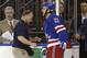 In this May 22, 2014 photo, New York Rangers center Derek Stepan (21) leaves the ice with a member of the Rangers staff after taking a hit from Montreal Canadiens forward Brandon Prust during the first period of Game 3 of the NHL hockey Stanley Cup playoffs Eastern Conference finals in New York. Stepan has a broken jaw and is undergoing surgery. Rangers coach Alain Vigneault made the surprising announcement Friday, May 23, 2014, on the first of two off days in the series New York leads 2-1. Prust wasn't penalized in the first period of Montreal's 3-2 overtime win Thursday night, but he faces an NHL hearing Friday and a possible suspension. (AP Photo/Kathy Willens)