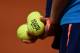 PARIS, FRANCE - MAY 25: A ballboy holds Roland Garros 2014 tennis balls during a match on day one of the French Open at Roland Garros on May 25, 2014 in Paris, France. (Photo by Matthias Hangst/Getty Images)