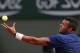 France's Jo-Wilfried Tsonga prepares to serve to compatriot Edouard Roger-Vasselin during the first round match of the French Open tennis tournament at the Roland Garros stadium, in Paris, France, Sunday, May 25, 2014. (AP Photo/Darko Vojinovic)