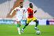 Iran's national soccer team player Ashkan Dejagah, left, runs with the ball as he is followed by Guinea's Issiaga Sylla in their friendly match at the Azadi (Freedom) stadium in Tehran, Iran, Wednesday, March 5, 2014. Guinea won the match 2-1. (AP Photo/Ebrahim Noroozi)