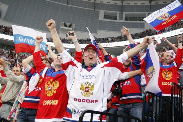 fans celebrate after Russia scores a goal during the gold medal match against Finland at the Ice Hockey World Championship in Minsk, Belarus, Sunday, May 25, 2014. (AP Photo/Darko Bandic)
