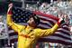 Ryan Hunter-Reay celebrates after winning the 98th running of the Indianapolis 500 IndyCar auto race at the Indianapolis Motor Speedway in Indianapolis, Sunday, May 25, 2014. (AP Photo/Tom Strattman)