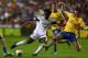 SWANSEA, WALES - SEPTEMBER 28: Wilfried Bony (L) of Swansea City pulls the trigger as Laurent Koscielny (R) of Arsenal attempts to block the shot during the Barclays Premier League match between Swansea City and Arsenal at the Liberty Stadium on September 28, 2013 in Swansea, Wales. (Photo by Michael Steele/Getty Images)