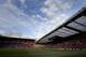 The stands are seen in the evening sunlight as Manchester United win 4-0 against Norwich City in their English Premier League soccer match at Old Trafford Stadium, Manchester, England, Saturday April 26, 2014. (AP Photo/Jon Super)