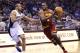 Cleveland Cavaliers' Luol Deng, right, drives around Orlando Magic's Arron Afflalo, left, during the first half of an NBA basketball game in Orlando, Fla., Wednesday, April 2, 2014. (AP Photo/John Raoux)