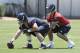 Houston Texans quarterback draft pick Tom Savage, right, takes a snap from James Ferentz during a rookie football mini-camp Friday, May 16, 2014, in Houston. (AP Photo/Pat Sullivan)