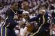 Indiana Pacers center Ian Mahinmi, left, and forward Paul George (24) attempt to block Miami Heat forward LeBron James during the second half of Game 4 in the NBA basketball Eastern Conference finals playoff series, Monday, May 26, 2014, in Miami. (AP Photo/Wilfredo Lee)