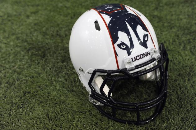 A Connecticut football helmet with new logo is seen during NCAA college football media day in Storrs, Conn., Friday, Aug. 9, 2013. (AP Photo/Jessica Hill)